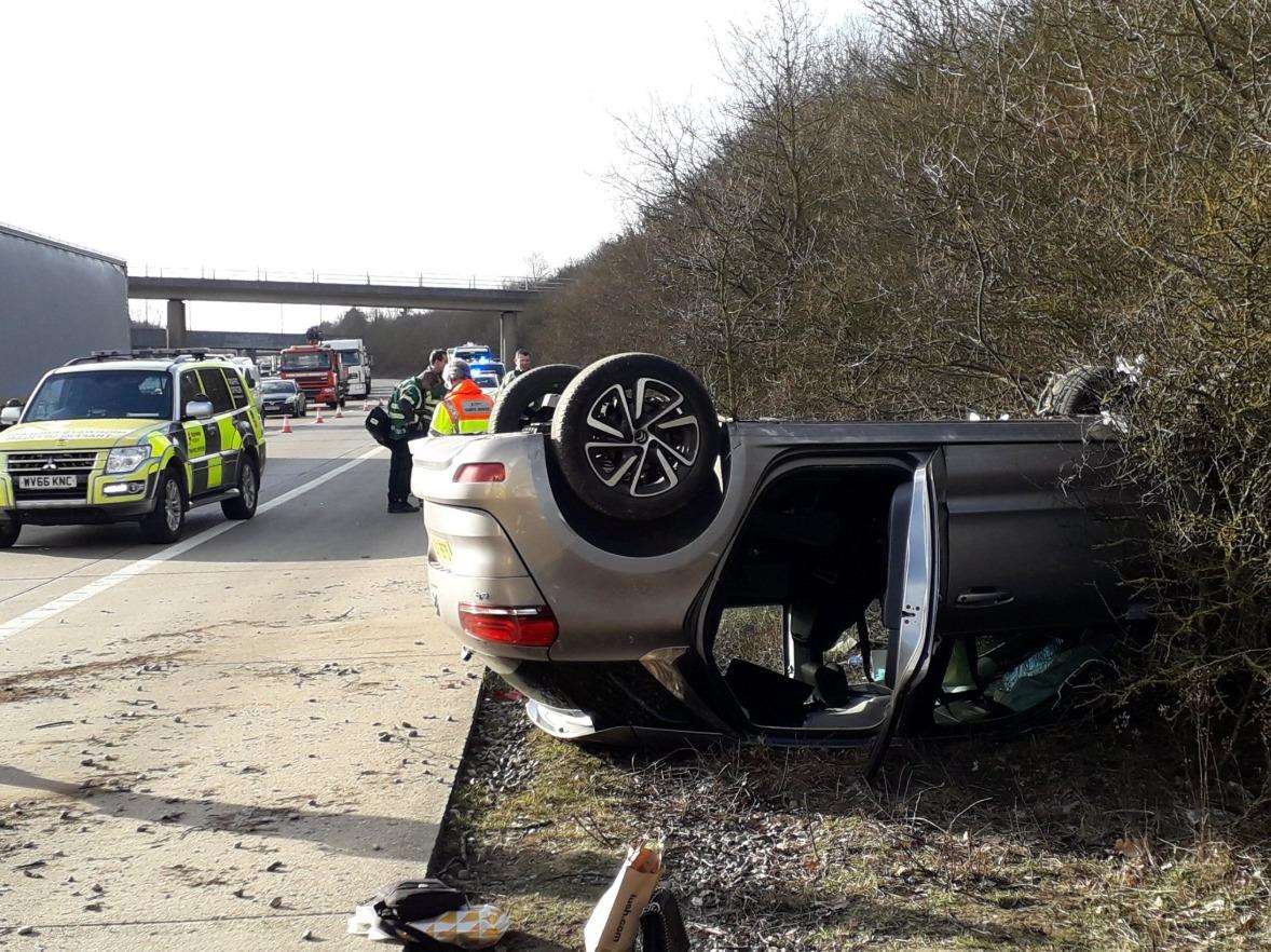 The overturned car on the M20 near Ashford. Picture: @KentSpecials