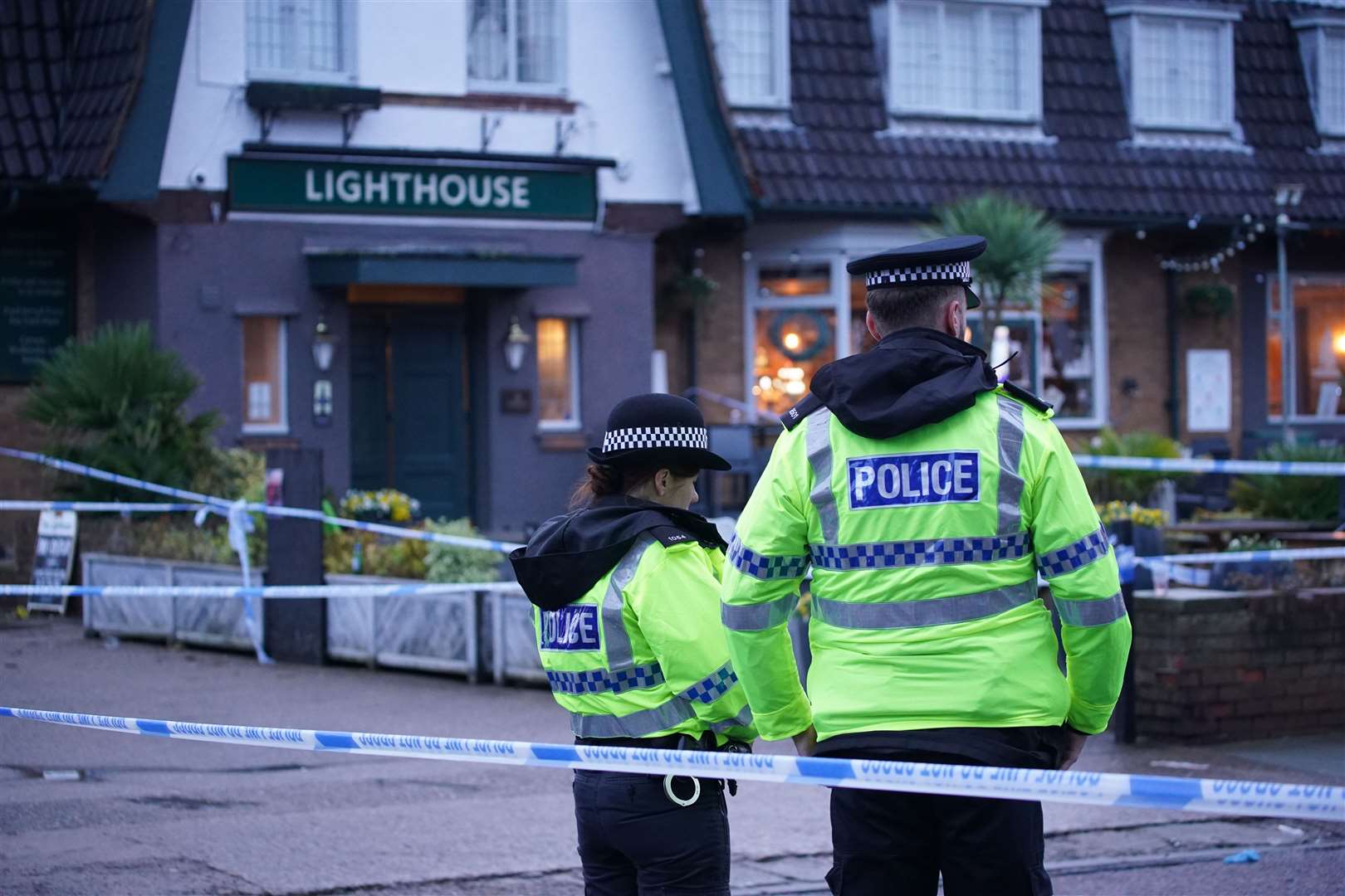 Police at the scene of the shooting at the Lighthouse Inn in Wallasey Village (PA)