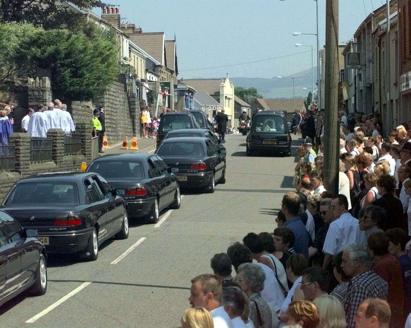 The funeral cortege of Doris Dawson, 80, Mandy Power, 34, and her daughters Katie, 10 and Emily, eight, who were murdered in 1999 (Tim Ockenden/PA)