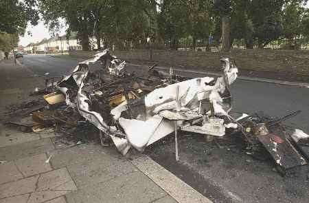 The charred remains of the caravan. Picture: BARRY CRAYFORD