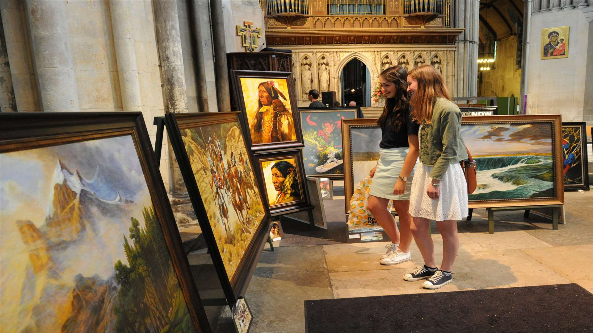 Vistitors to the cathedral check out Dennis Hussey's art exhibition