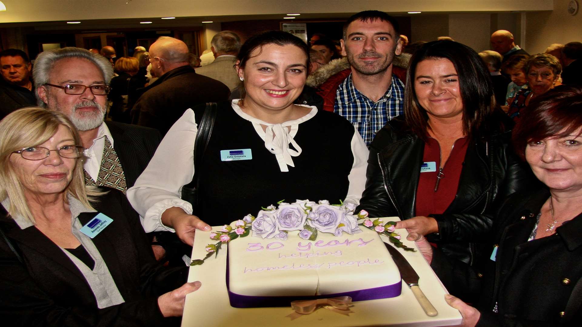 Centre manager Zofia Grzymala with staff celebrating the Homeless Care's 30th anniversary. Picture: Alan Reading
