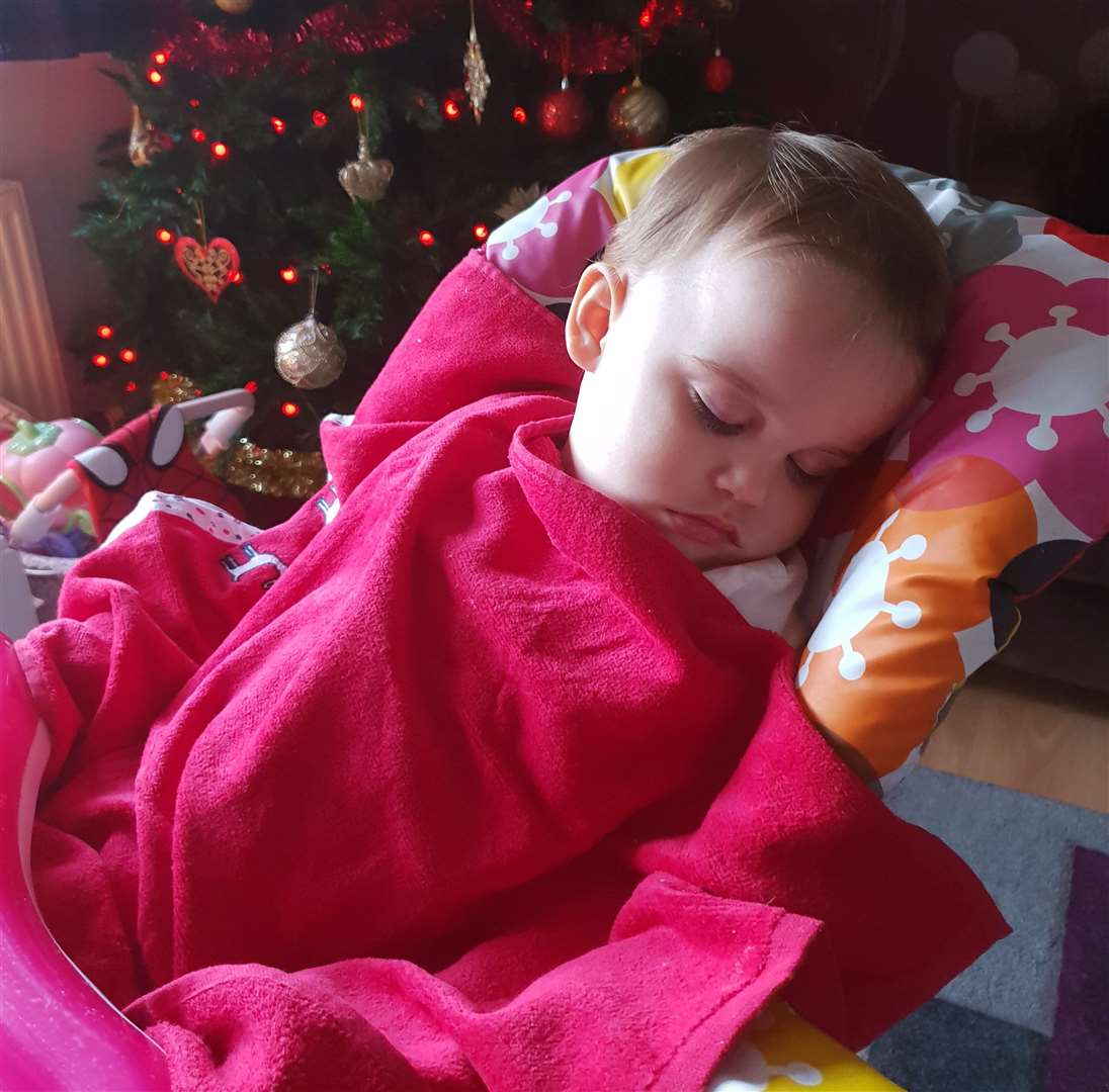Chloe Ford having a sleep next to the Christmas tree the day before she died