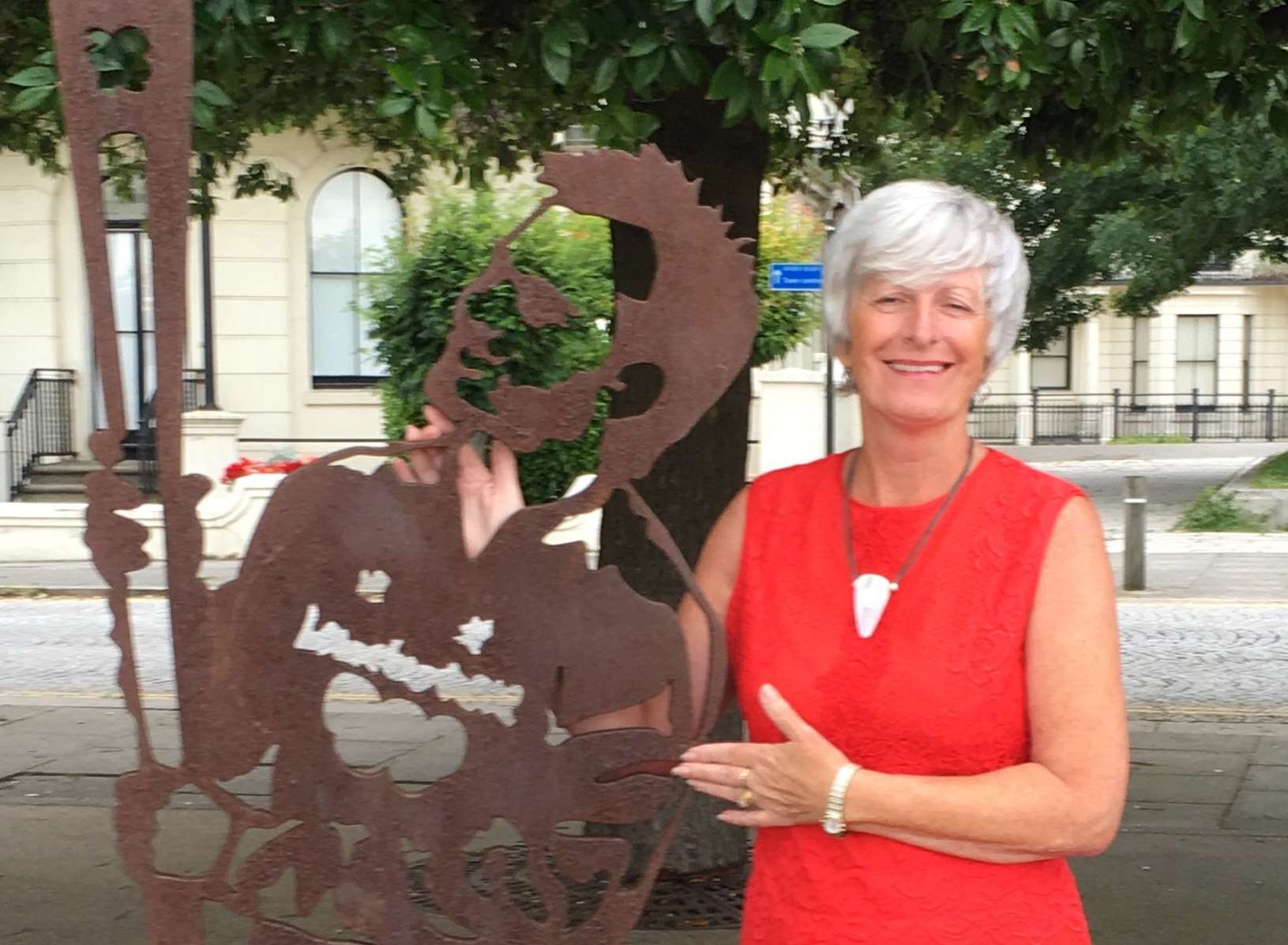 Chairman of Pegasus Playscheme Sue Clark with her son's statue on Dover seafront