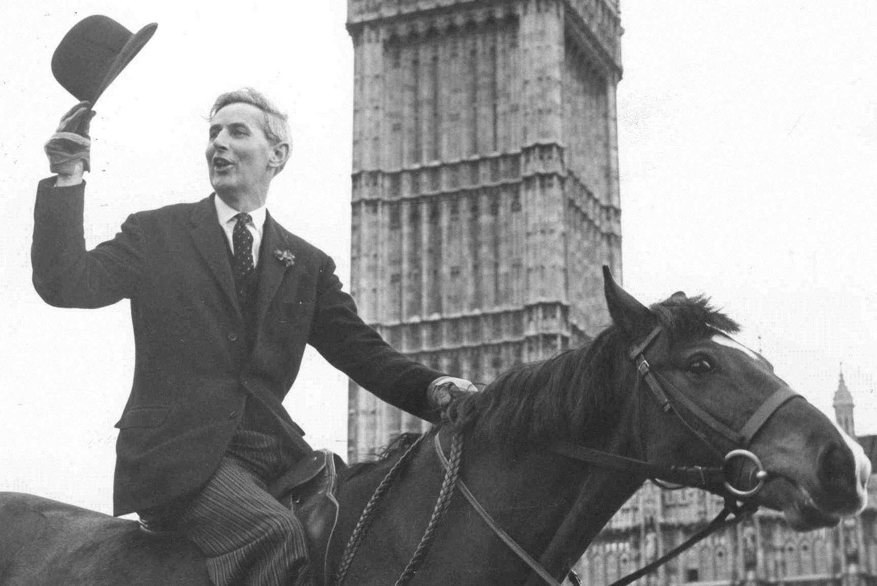 Sir John outside Parliament on his horse