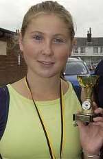 TALENTED: Rebecca with her medal after winning a 10k race in Deal last year