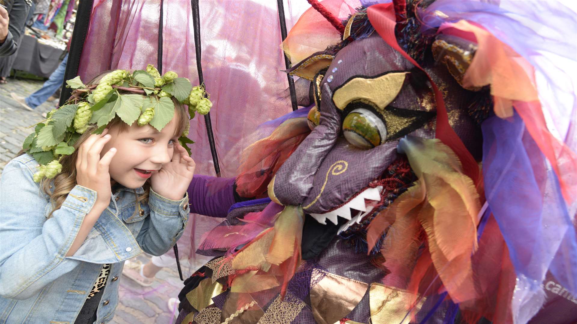 Macie Pritchard meets one of the dragons in Court Street at last year's festival