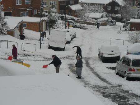 People clearing snow in Brambledown,Chatham