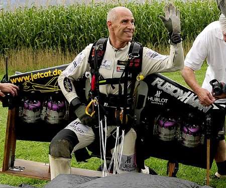 Yves Rossy celebrates a previous successful landing. Picture courtesy Alain Sauquet / Cirrus / National Geographic Channel