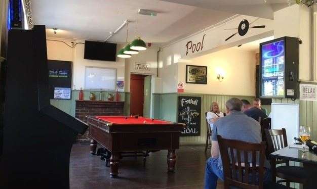 The majority of the left hand side of pub is given over to the pool table, dartboard and jukebox