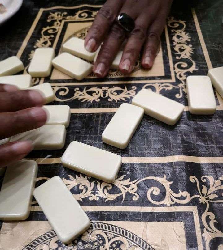 Men would play dominos as they would have in the Caribbean