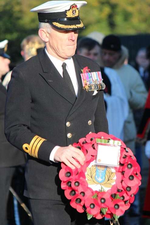 Commander Nicholas Chatwin lays a wreath in Gillingham. Picture: Darren Small