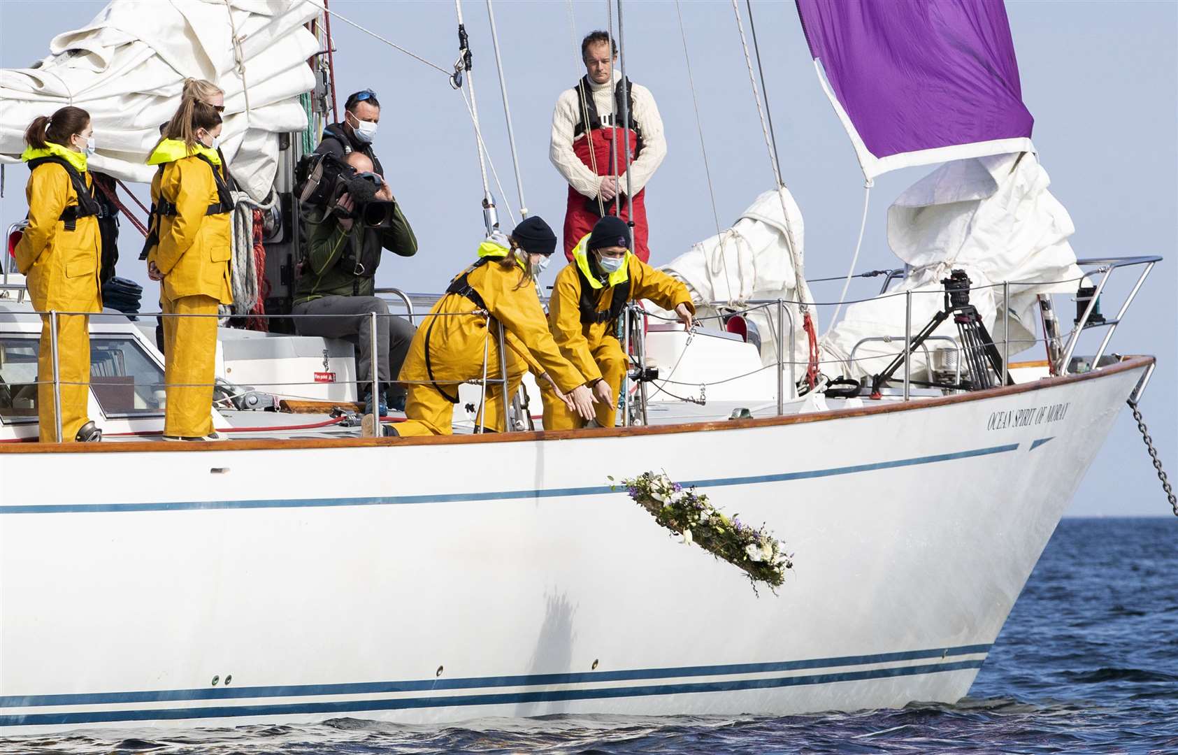 Young sailors at the Duke of Edinburgh’s former school, Gordonstoun, lay a wreath at sea (Jane Barlow/PA)