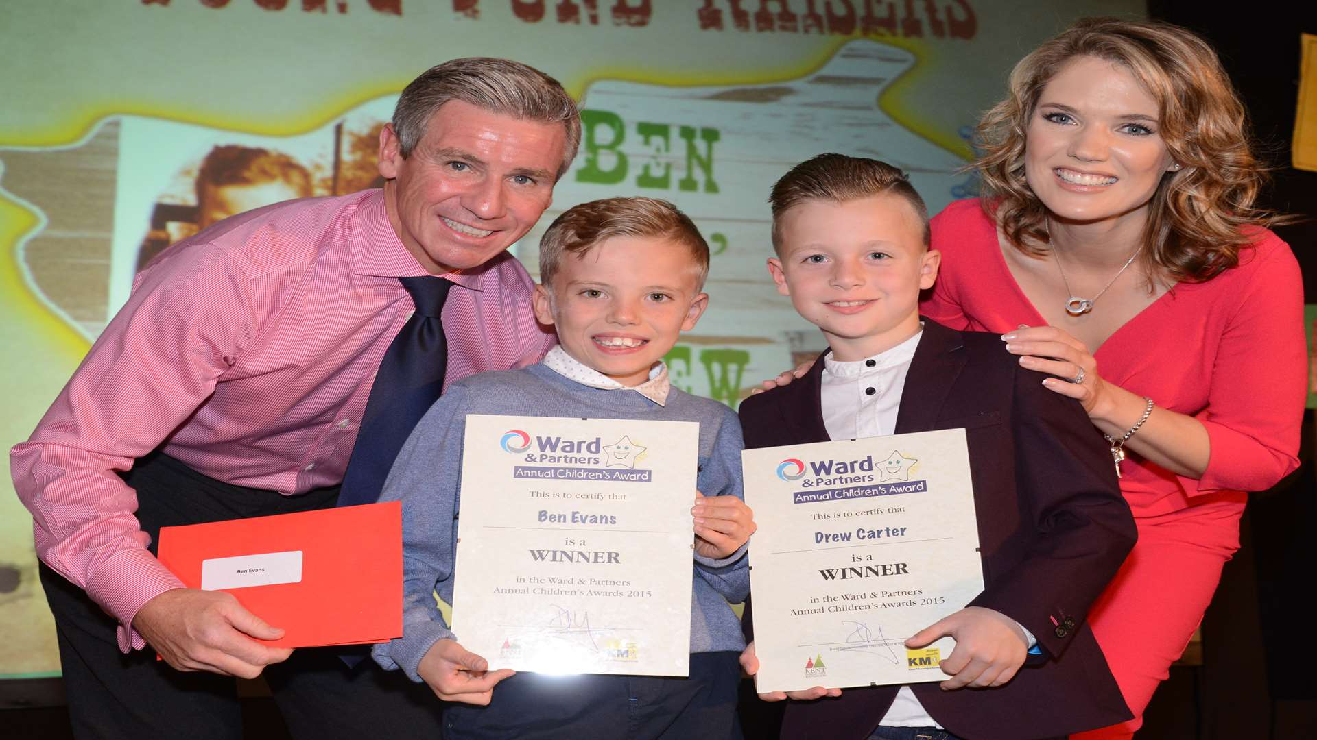 Charlotte Hawkins and Keith Lovell, financial services director for Arun Estates, presenting award to Ben Evans and his best friend Drew Carter