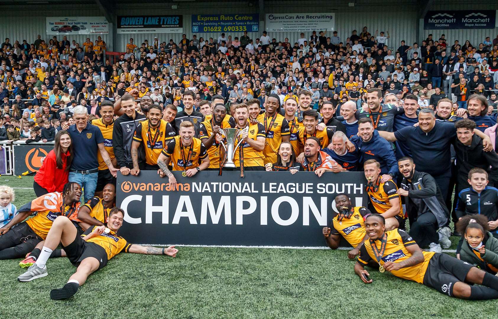 Maidstone United celebrate with the fans after winning the National League South in 2022