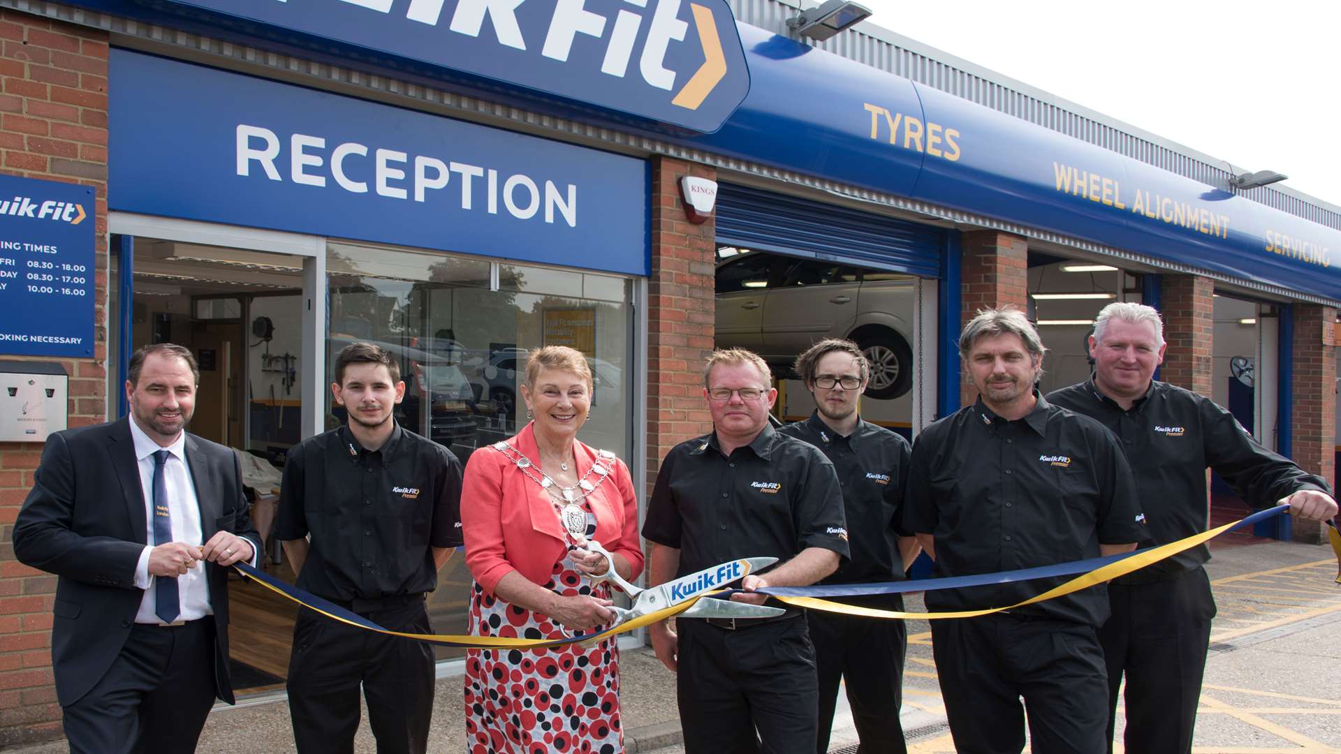 The Sheriff of Canterbury, Cllr Rosemary Doyle, cuts the ribbon on the revamped Whitstable workshop with staff