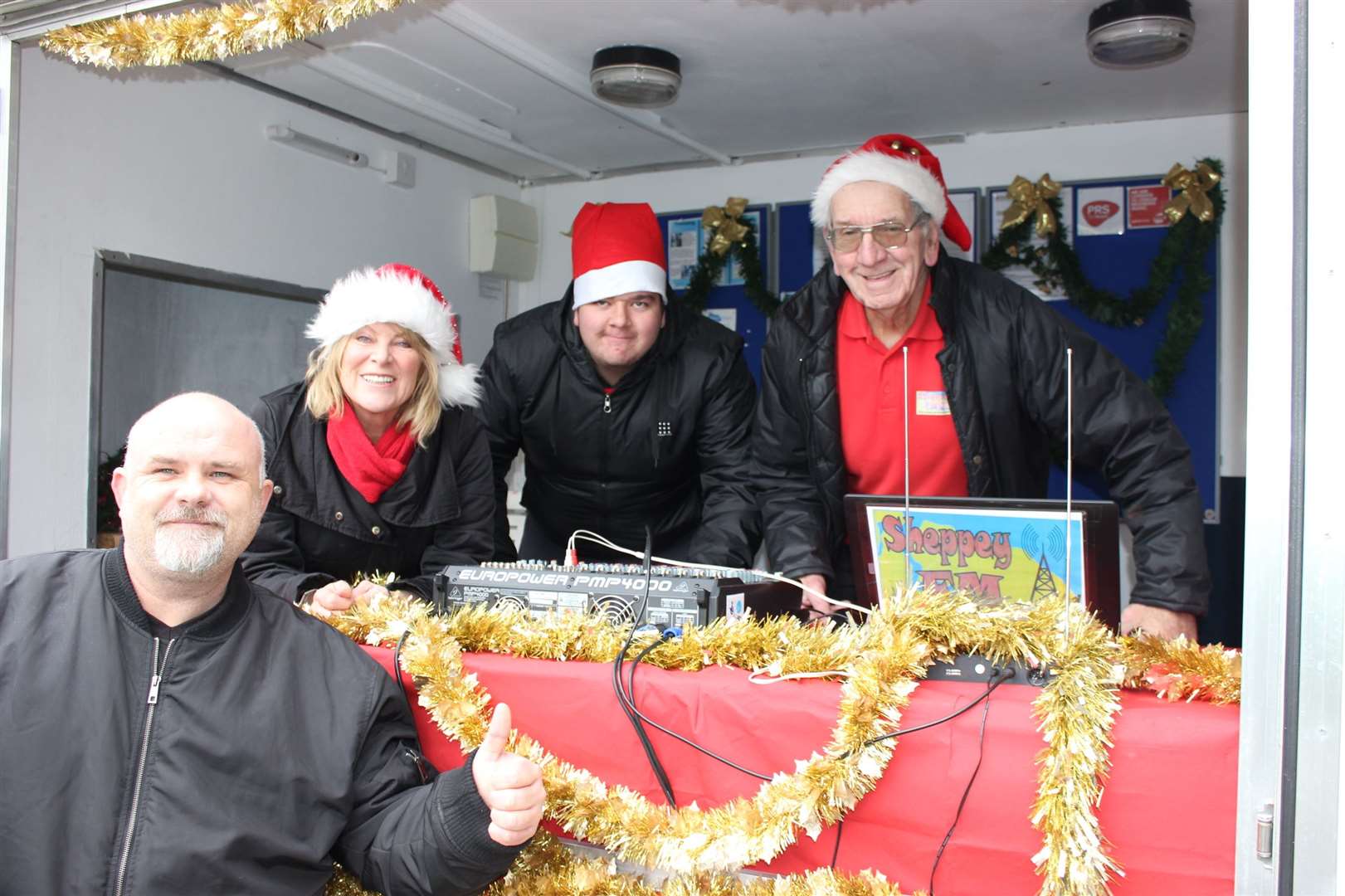 Noel Pritchard, right, with the Sheppey FM roadshow crew at a Sheerness Christmas lights switch-on