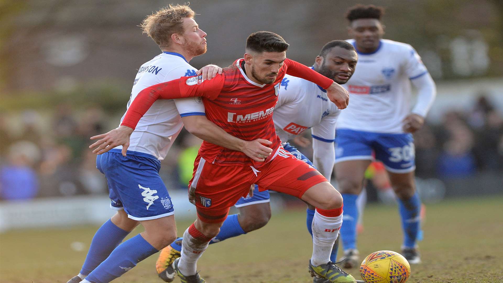 Conor Wilkinson takes on Bury's Adam Thompson Picture: Ady Kerry