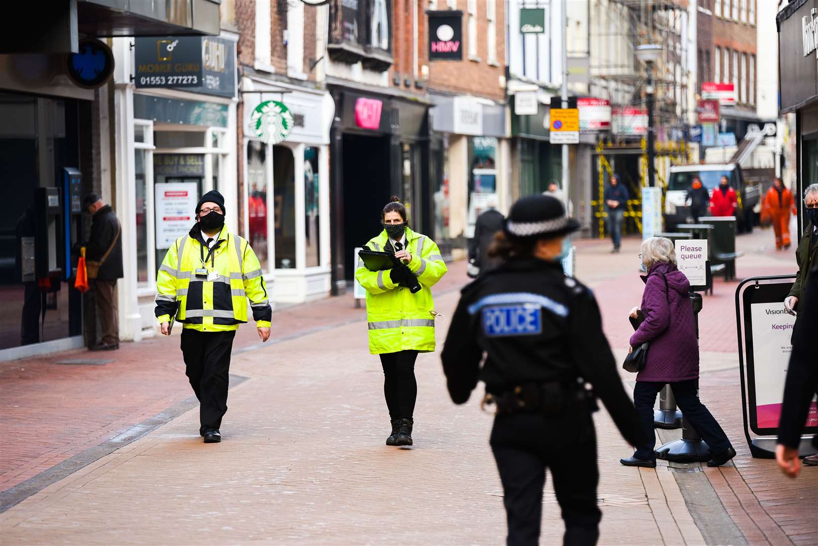 Covid-19 marshalls and police patrolling town centres. Picture: Ian Burt