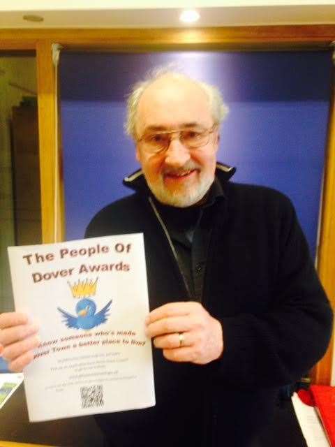 Dover mayor Chris Precious with a People of Dover Awards poster
