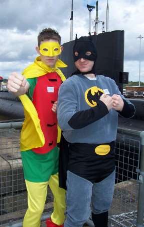 Lea Goddard and Paul Margerum dressed as Batman and Robin for the abseil from HMS Ocelot.
