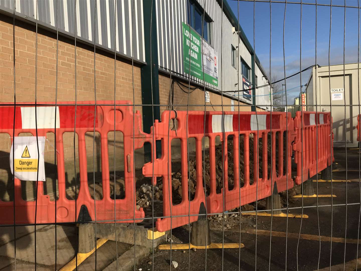 The pavement outside the empty store has been dug up as alterations are made to its shop front