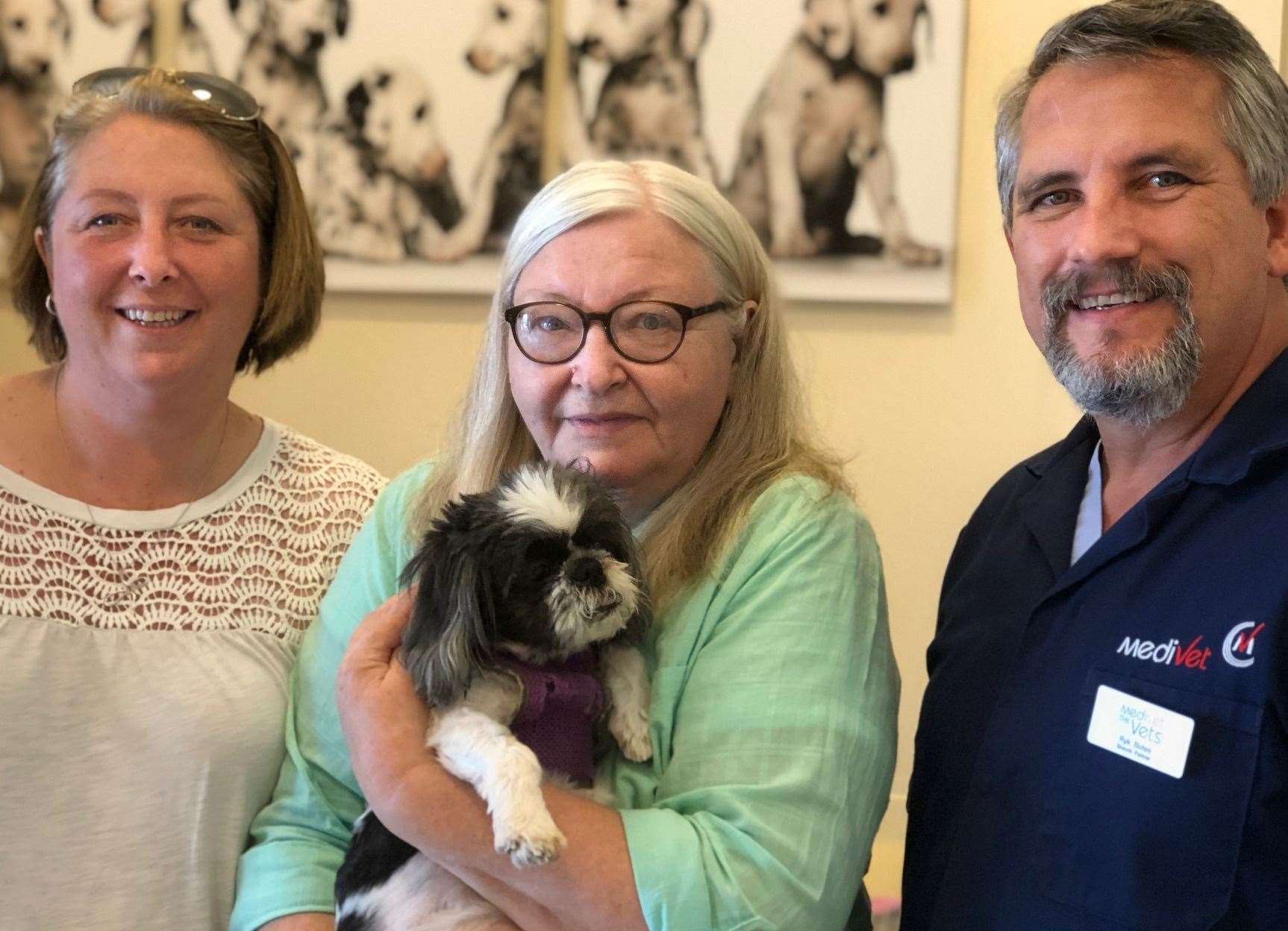 Owner Daphne Harrigan (middle), daughter Debbie Crouch and vet Dr Ryk Botes with Poppet after surgery