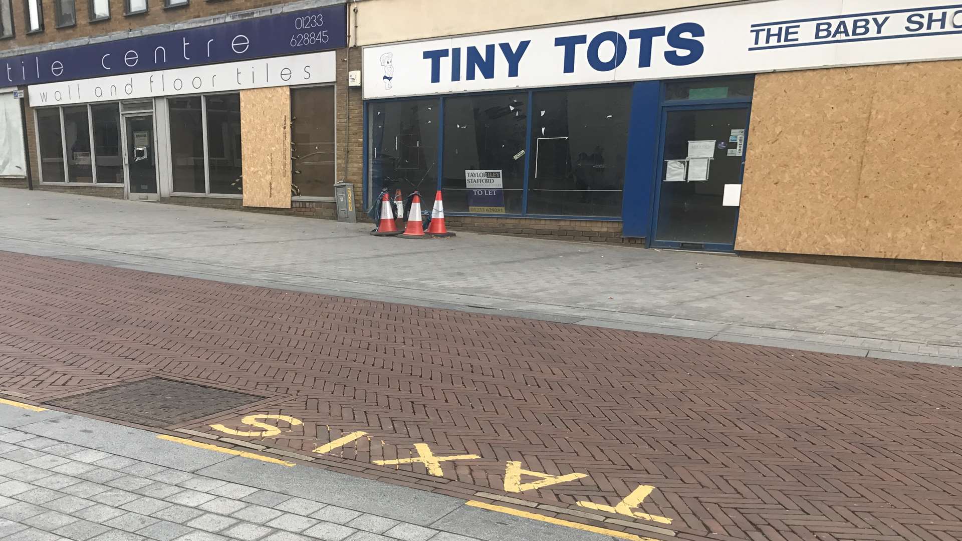 The missing manhole cover is outside Tiny Tots