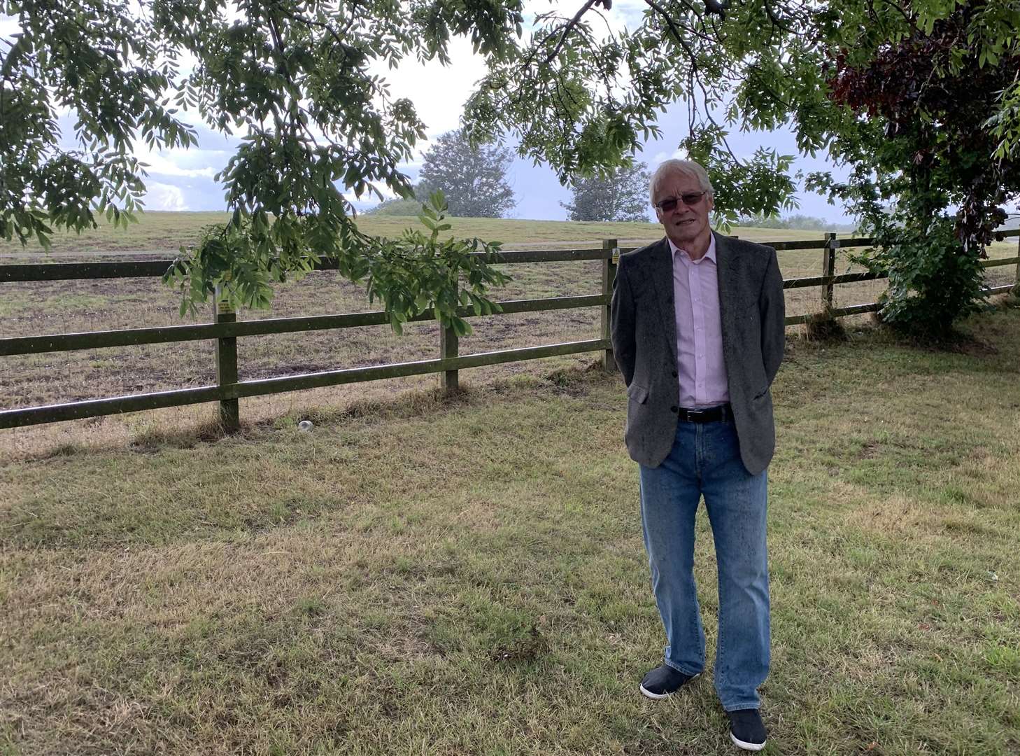 Minster Parish Council member, John Stanford, standing at the site of the proposed housing