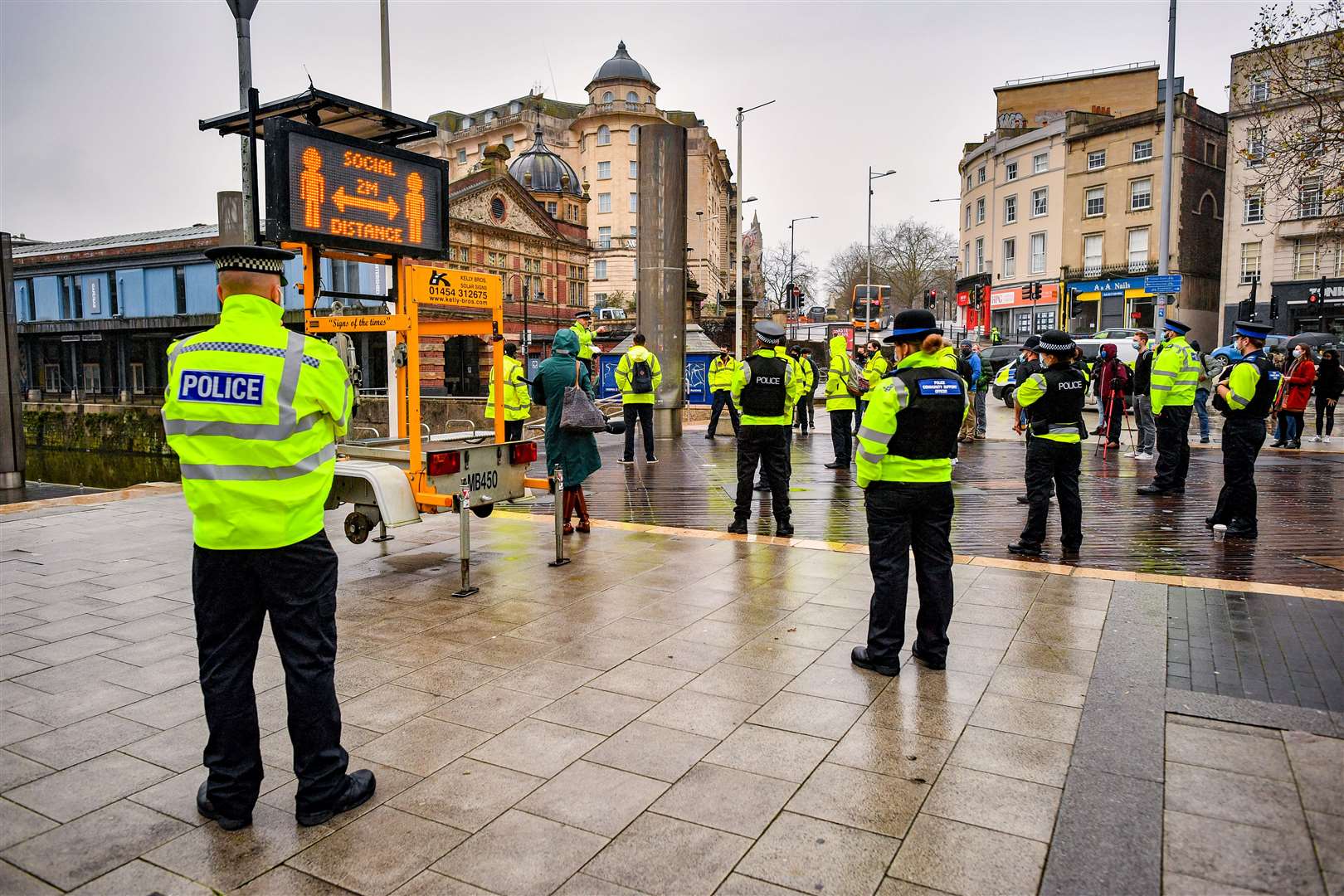 Police officers and Bristol Council Covid marshals meet in the city centre for a briefing during a day of action to reinforce coronavirus lockdown regulations at targeted locations around Bristol (Ben Birchall/PA)
