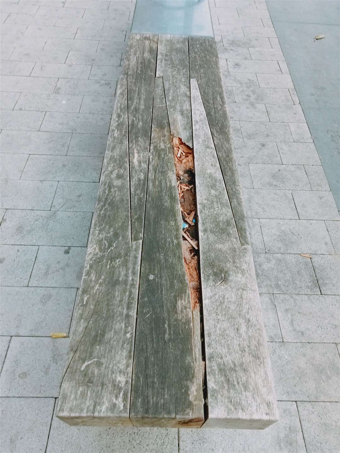 A bench outside Natwest in Chatham which is damaged