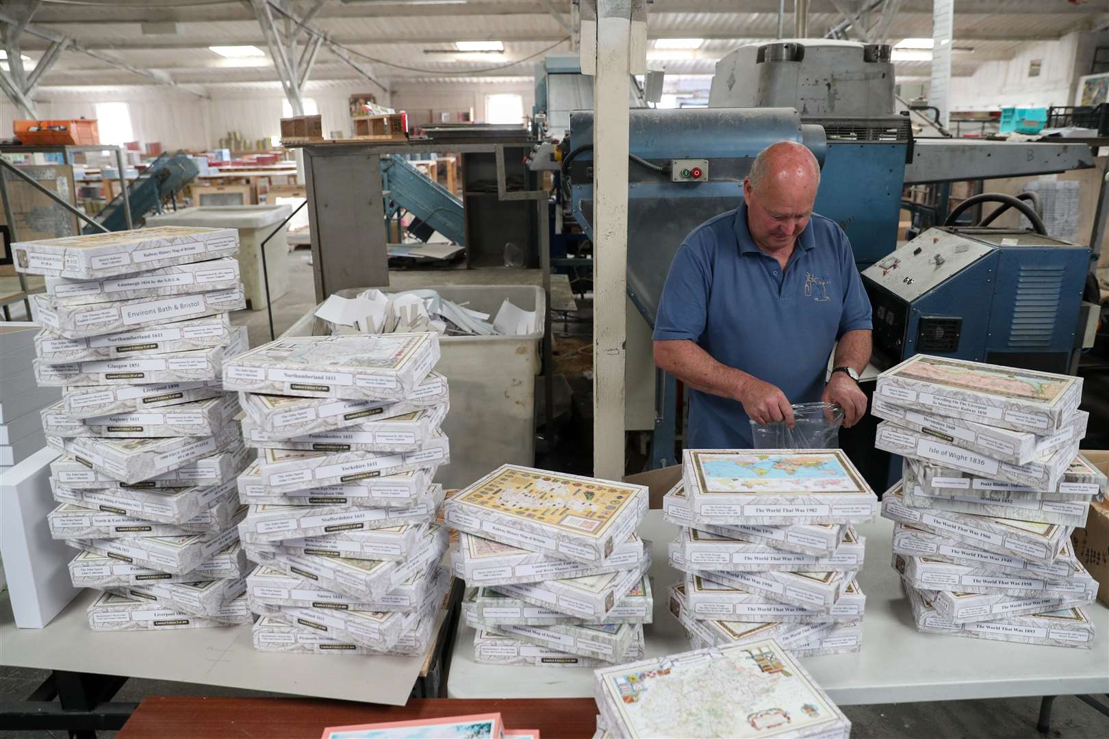Freshly cut jigsaw puzzles are bagged up and boxed at JHG Jigsaws Ltd in Ashmore, Dorset, which has seen a surge in demand during the lockdown (Andrew Matthews/PA)