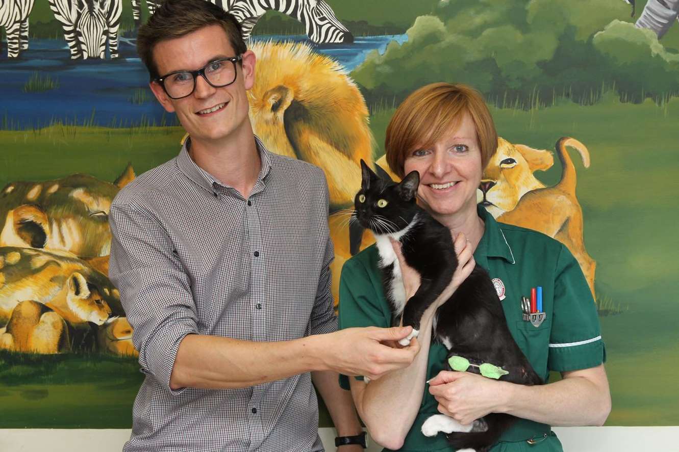 Lukas Bates and veterinary nurse Liz 'Bill' Ryan with Steve Austin the cat.