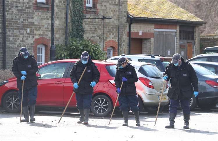 Search teams in the Co-op car park Picture: PA/Gareth Fuller