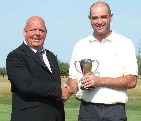 New Sheerness GC champion Ryan Whittington (right) receives his trophy from club vice-captain Ken Quin