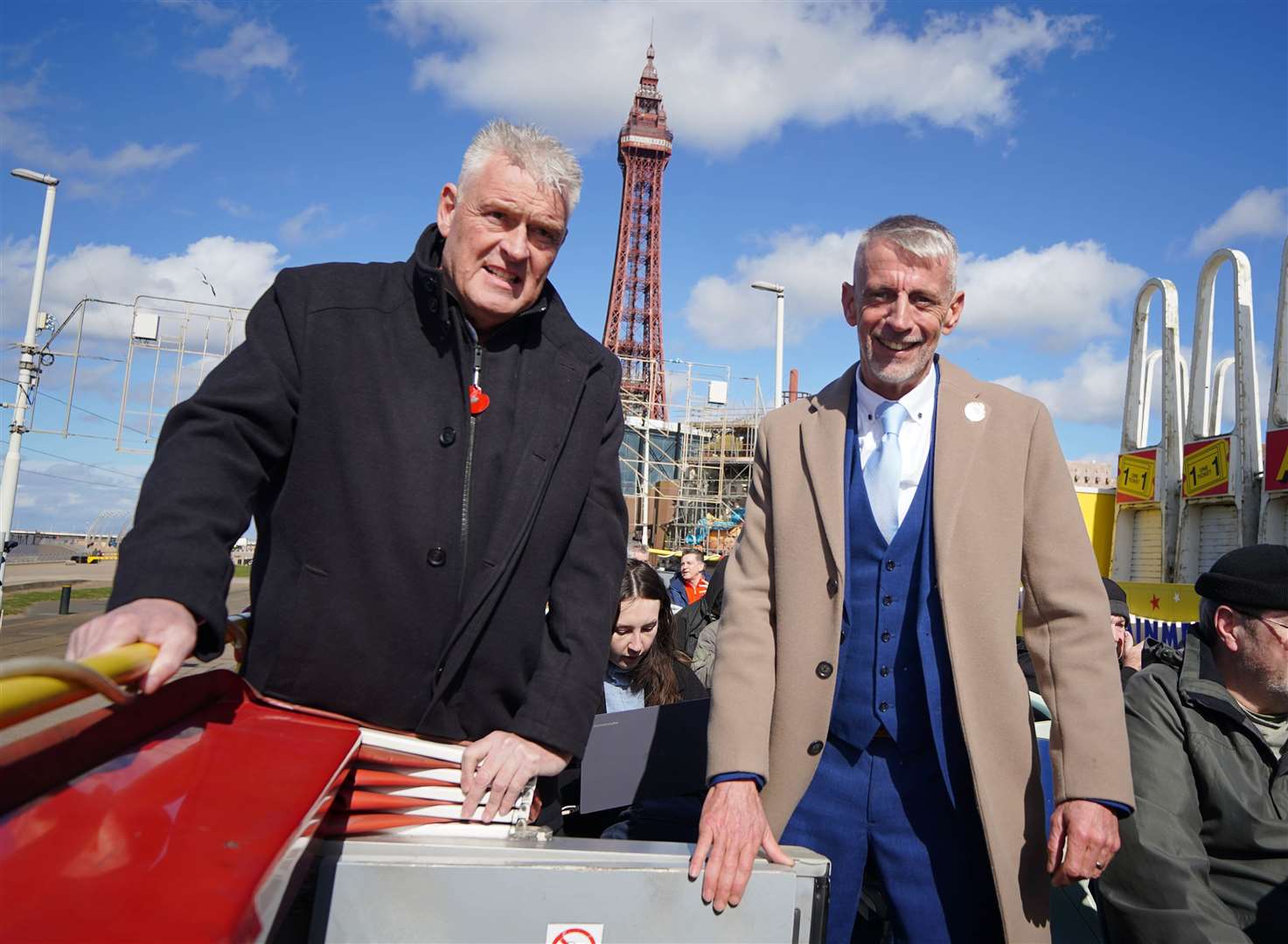 Lee Anderson, left, and Mark Butcher travel through Blackpool on an open top bus during a campaign event (Peter Byrne/PA)