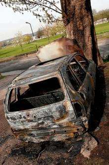 A burnt out car in Rochester