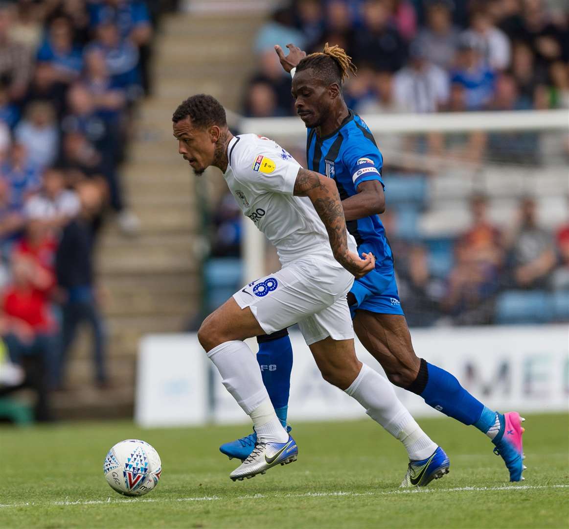 Gabriel Zakuani closes in on Jonson Clarke-Harris in the weekend game against Coventry Picture: Ady Kerry