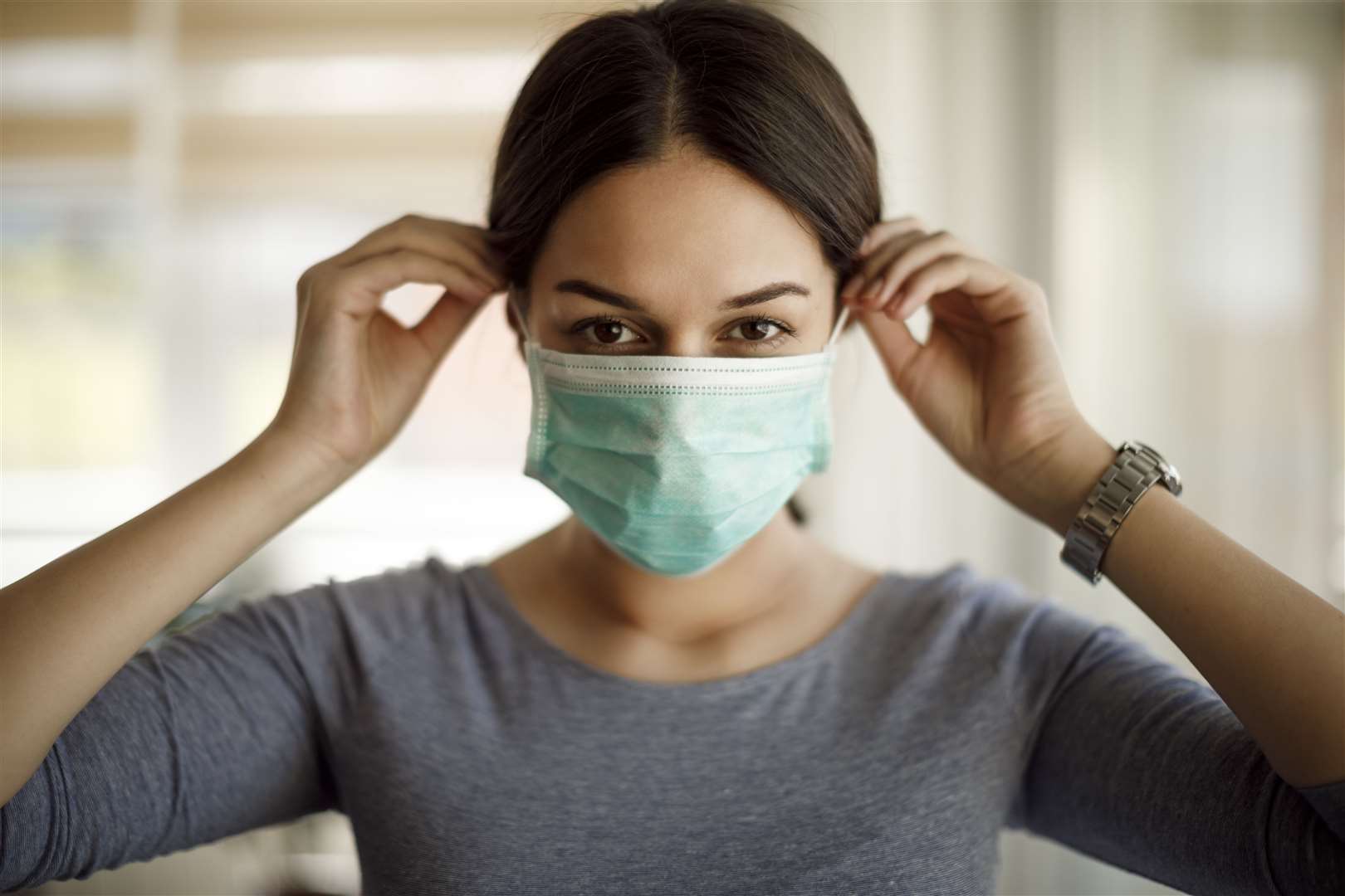 People are being warned to keep on face masks. istock picture posed by model