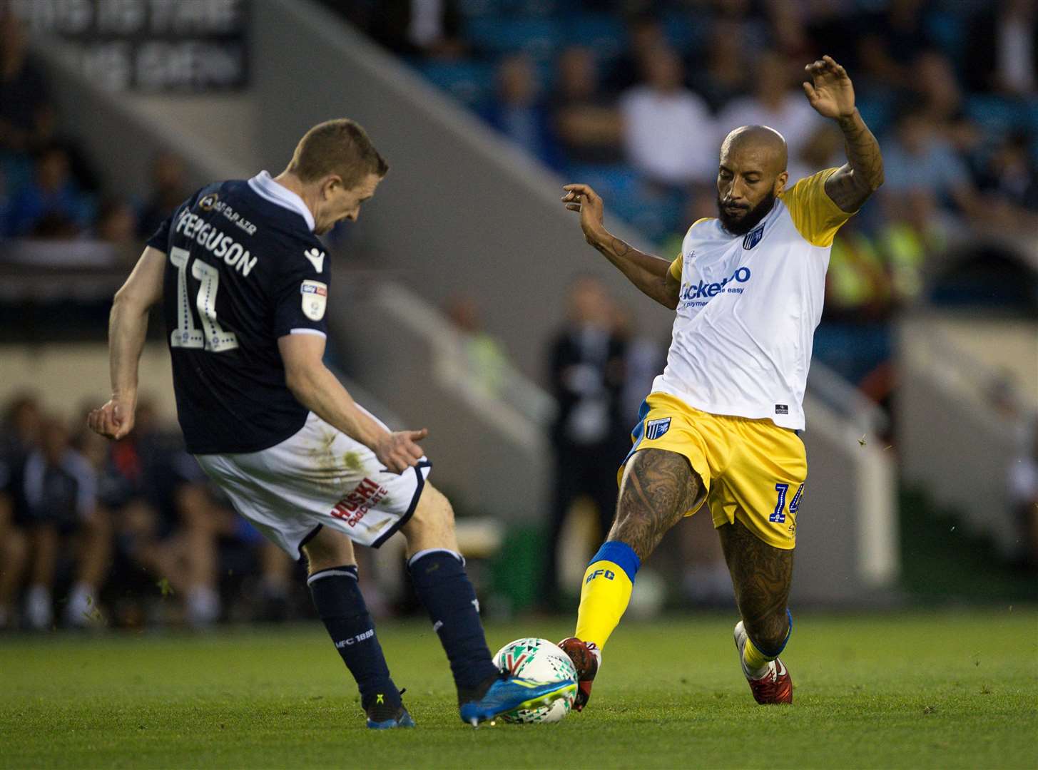 Josh Parker challenges with Millwall's Shane Ferguson on Tuesday night Picture: Ady Kerry