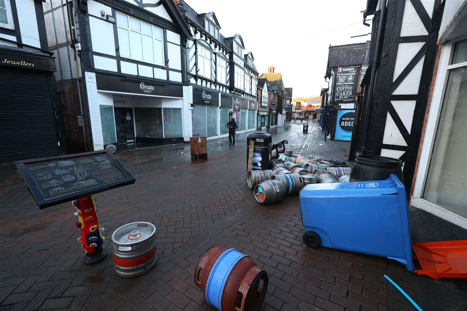 Barrels of beer and other debris floated down the streets of Northwich during flooding (Peter Byrne/PA)