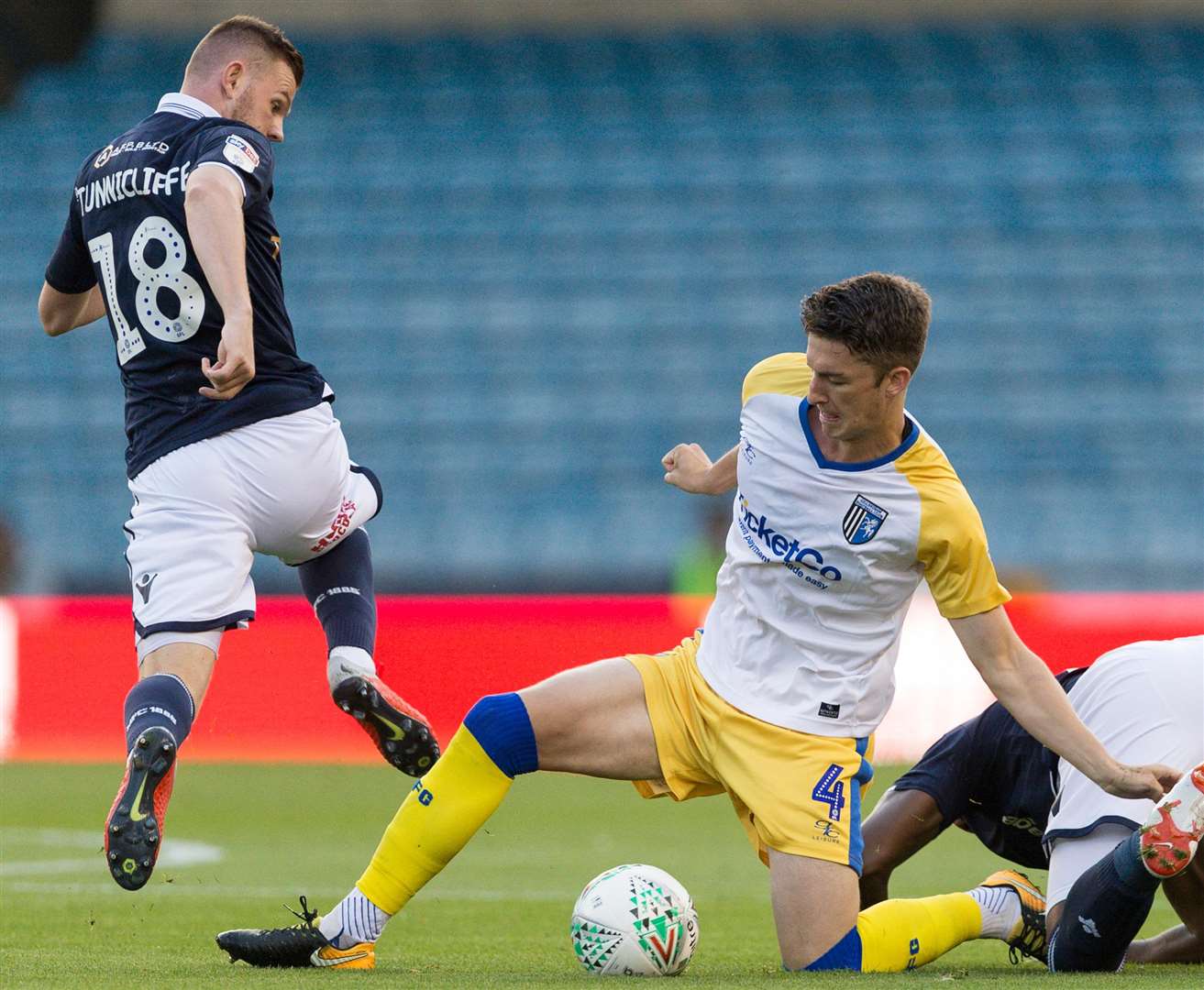 Alex Lacey wins the ball under pressure from Millwall's Ryan Tunnicliffe Picture: Ady Kerry