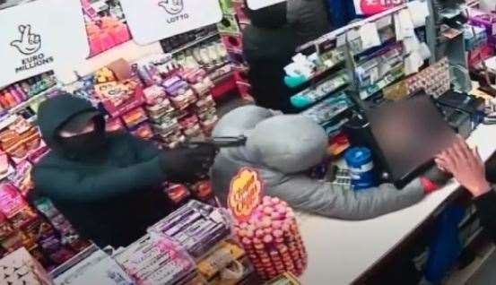 CCTV shows armed robbers in a Strood shop. CCTV from Kent Police