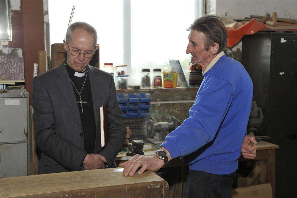 Richard Eckhard shows the Archbishop the latest refurbishment that he is working on.