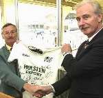 TON-UP MAN: John Clark, left, receives the signed shirt from Paul Millman. Picture: DEREK STINGEMORE