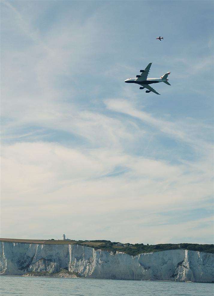 The UK's first A380, the biggest passenger plane ever built, flying over the White Cliffs and the South Foreland Lighthuose