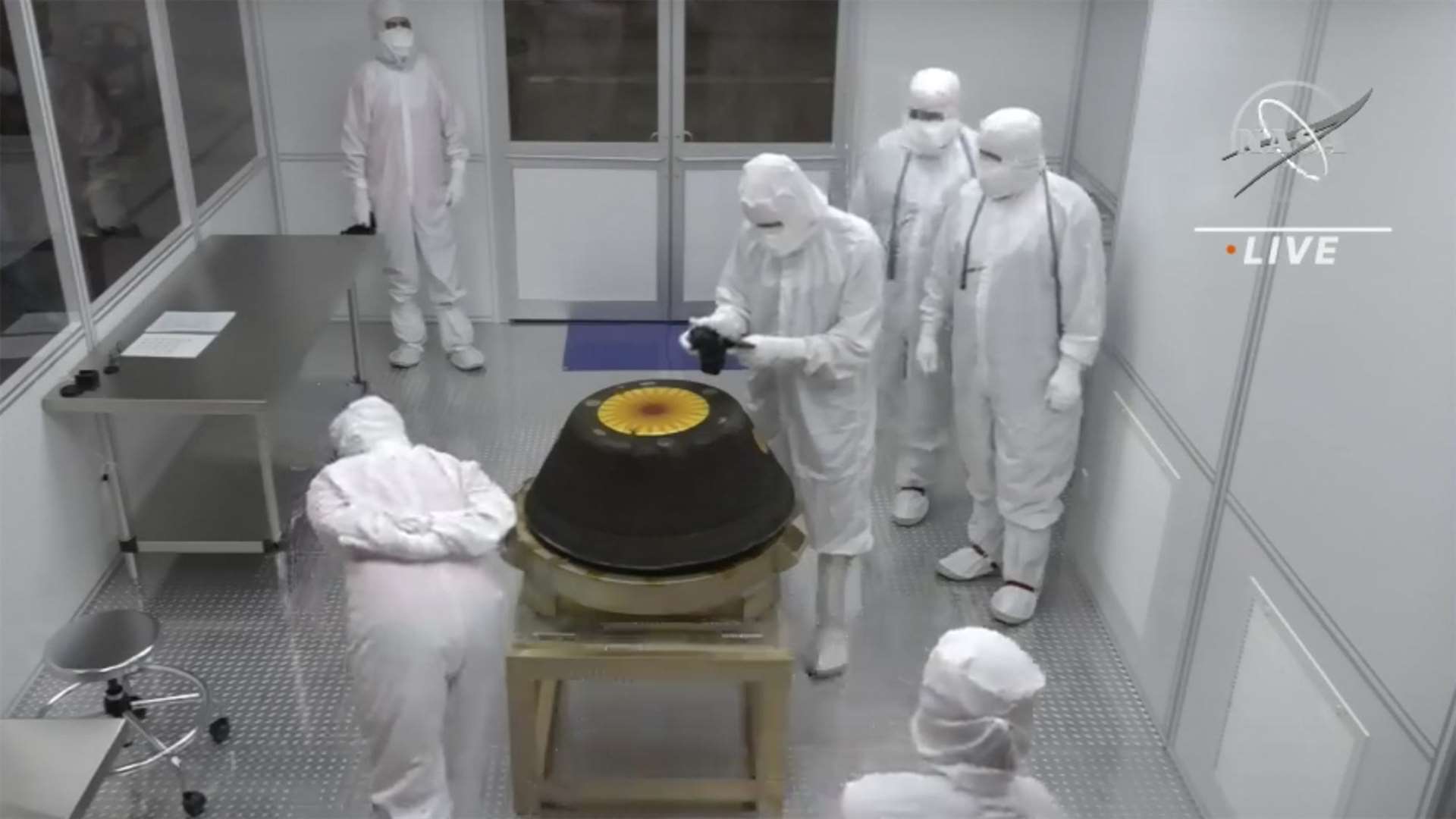 Technicians examine the sample return capsule from Nasa’s Osiris-Rex mission (Nasa via AP/PA)