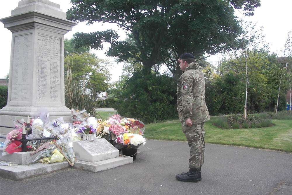 A soldier pays his respects to Drummer Lee Rigby at Sheerness war memorial