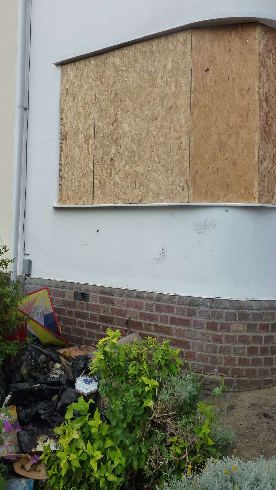 Boarded-up windows at a GIllingham house struck by lightning