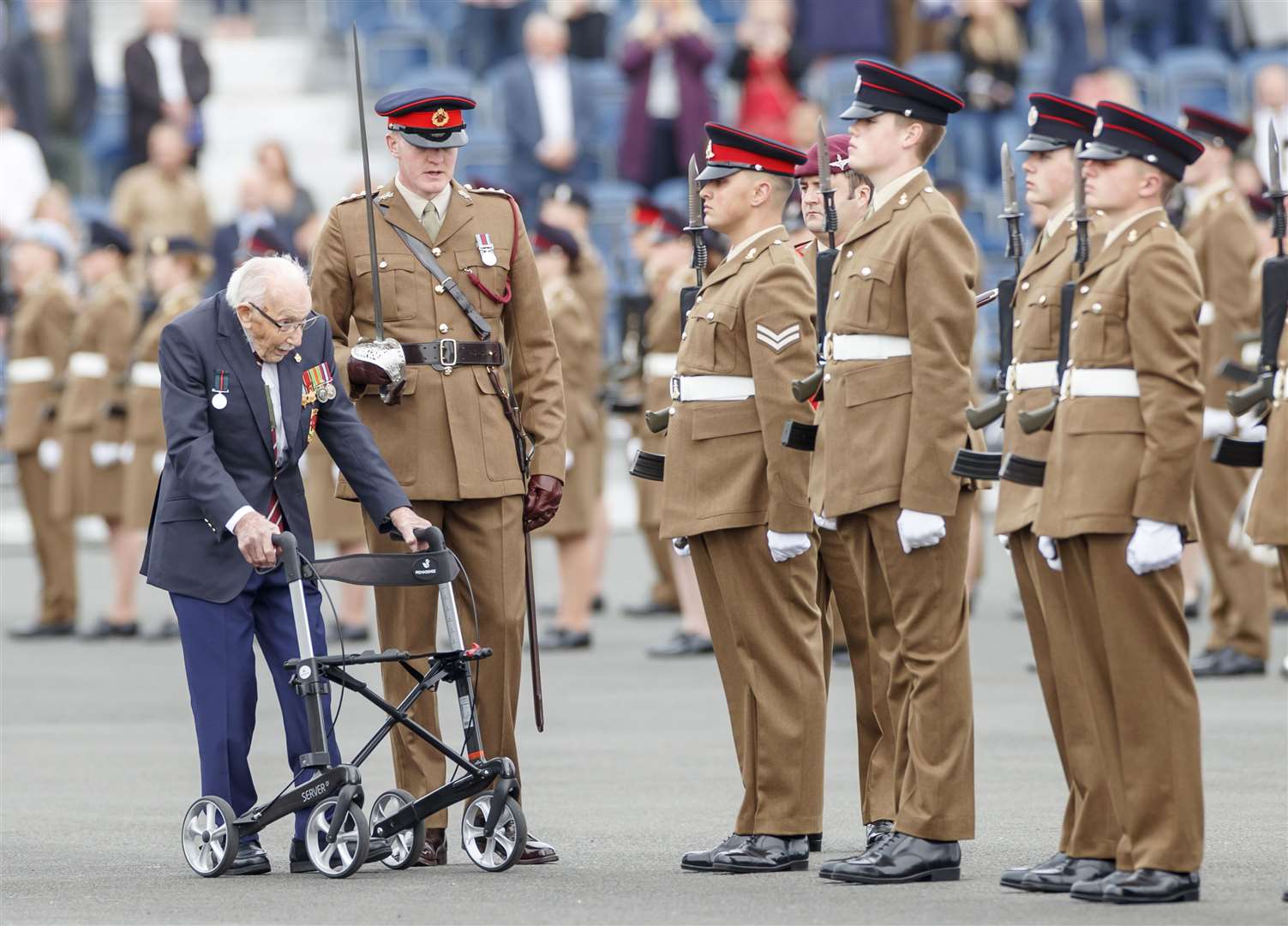In the role of Chief Inspecting Officer, Captain Sir Tom Moore, inspects the Junior soldiers (Danny Lawson/PA)